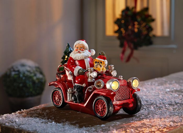 Weihnachtsmann mit Oldtimer aus Polyresin 