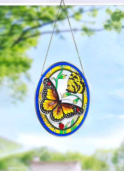 Glasbild mit Metallrahmen und Metallkette 